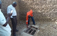 A technical committee inspecting an illegal mining pit