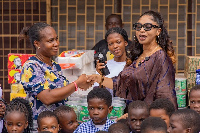 Former MP for Dome-Kwabenya, Adwoa Safo (in shades), presenting the items to officials of the home