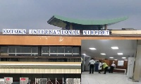 The Kotoka Int. Airport [Inset] A passenger being searched at the Domestic seciton of the airport