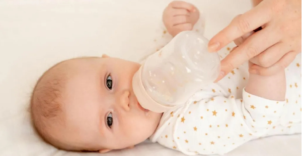 A baby is seen being fed