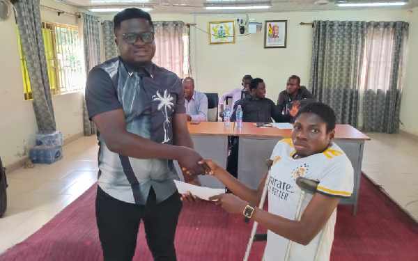 A person with disability seen receiving an envelope