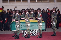 Soldiers salute the remains of the former minister