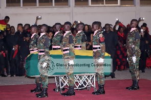 Soldiers salute the remains of the former minister