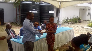 Larry Addo making a presentation to one of this year's beneficiaries