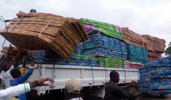 Truck loaded with mattresses