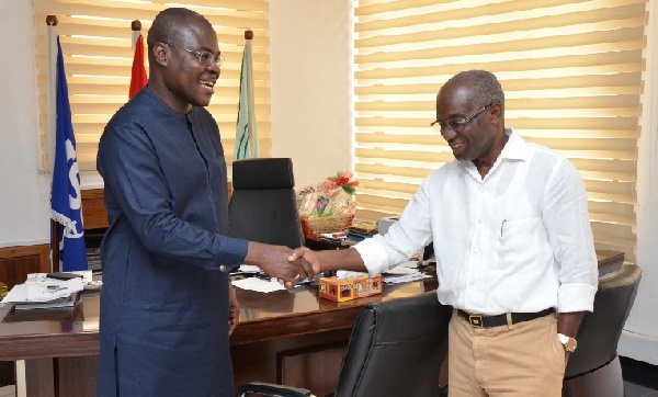 Prof Alex Dodoo (left) congratulating Dr Asamoa-Baah