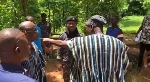 Johnson Asiedu Nketiah (2nd left) aruguing with a man at a Kumawu polling station