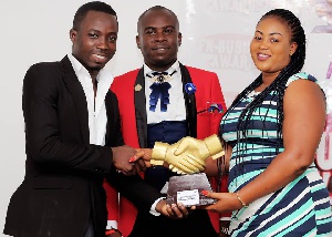 A winner receiving his award