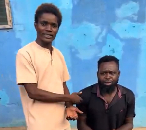 A photo of the guy kneeling alongside his friend