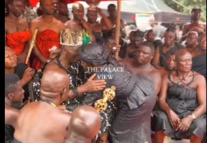 former First Lady of Ghana, Nana Konadu Agyeman-Rawlings hugging Otumfuo Osei Tutu II