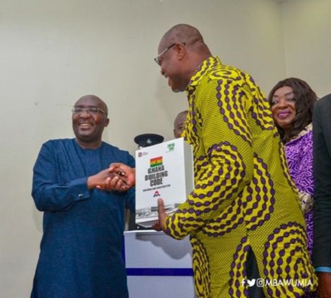 Vice President Dr Mahamudu Bawumia receiving a copy of the building code