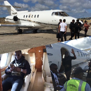 The private jet on the tarmac while the pastor and his officials inspect the interior