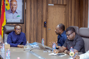 Minister for Energy, Dr John Abdulai Jinapor (M) and Managing Director of TOR, Edmond Kombat (R)