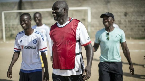 George Weah plays football once a while