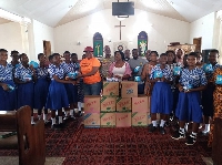 The MCE and some of the students receiving the items