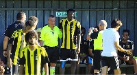 Referee pose with Sulley Muntari ahead of game
