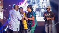 Joyce Blessing and Kumi Guitar receiving an award