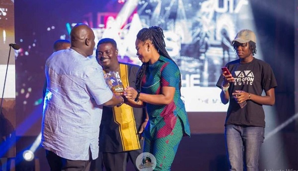 Joyce Blessing and Kumi Guitar receiving an award