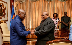 President Akufo-Addo (L) in a warm handshake with Former Tanzanian President Benjamin Mkapa (r)