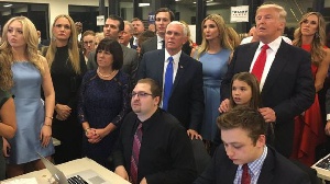 Mr Trump and his family watch the results come in