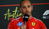 Ferrari's Lewis Hamilton speaks at a news conference ahead of the US Grand Prix