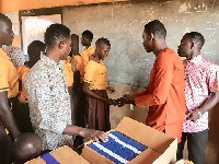 Emmanuel Boakye Yiadom making the donation to Kangoo Yamsuk school