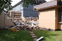 The fence wall of a warehouse collapsed at the weekend and destroyed the property of other residents
