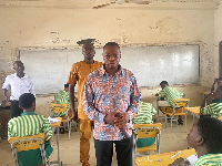 Kingsley Nyarko interacting with students at one of the examination centers in his constituency