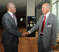 Vice-President Amissah-Arthur and former President of Fiji, Mr. Ratu Epeli Nailatikau in a handshake