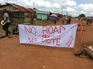 A 'No road, No vote' banner ready to greet Mahama