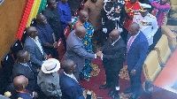 Akufo-Addo and Mahama interacting in Parliament