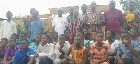 A group picture of Chiefs and BECE candidates of Ekpoku-Tandan