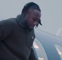 Antoine Semenyo getting down from the private jet