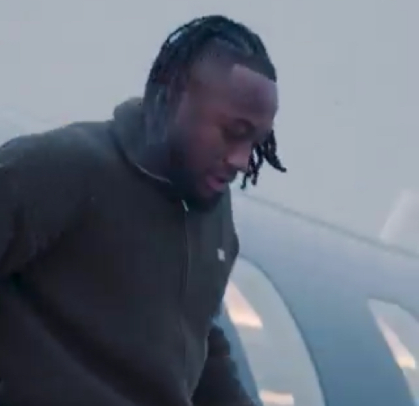 Antoine Semenyo getting down from the private jet