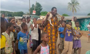 Abalo Kwesi, the suspected thief carrying the goat