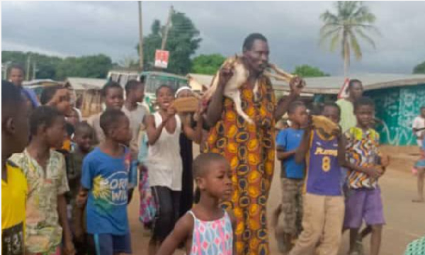 Abalo Kwesi, the suspected thief carrying the goat