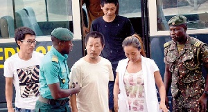 Aisha Huang(second from the right) was arrested for indulging in several illegal mining activities
