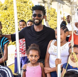 Bisa  Kdei with some of the children who need scoliosis surgeries.
