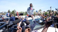 Presidential hopeful Mr Robert Kyagulanyi flanked by press corps and his supporters