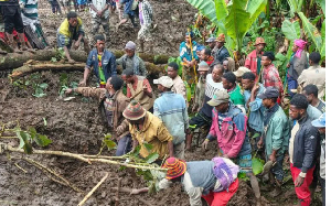 Residents search for the bodies of mudslide victims in the Gacho Baba district of the Gamo