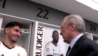 Club president Florentino Perez interacts with one of the players
