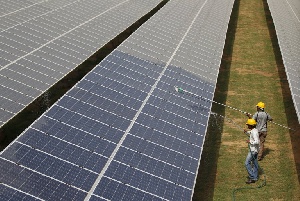 Workers Clean Solar Panel In Gujurat
