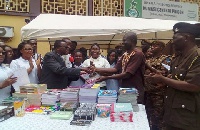 Members of Kufuor Scholars making the donation