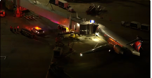 First responders are seen near a plane following an emergency landing in Houston, Texas, on Feb 18