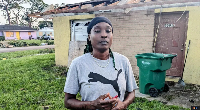 Crystal Coleman stands in front of the ruins of her home in south Florida