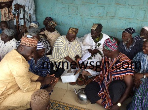 Some elders of Nayiri smile whiles counting the cash