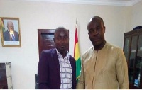 Hon Isaac Asiamah (R) in a handshake with Mr Osei Asibey