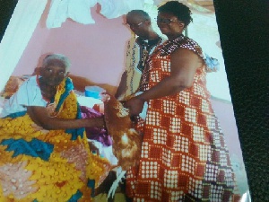 An old lady receiving some gifts from the Nkansah family
