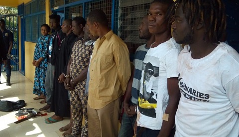 Suspects paraded on a corridor at the Regional Police Headquarters