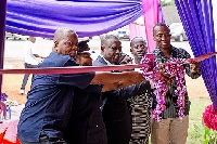 Elders of the community and some officials cutting the tape